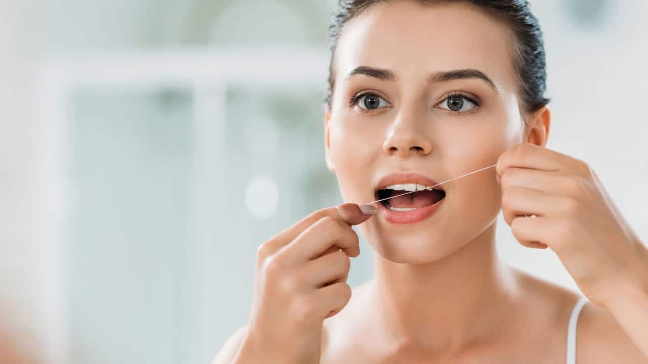 The Link Between Poor Flossing and Gum Disease Woking